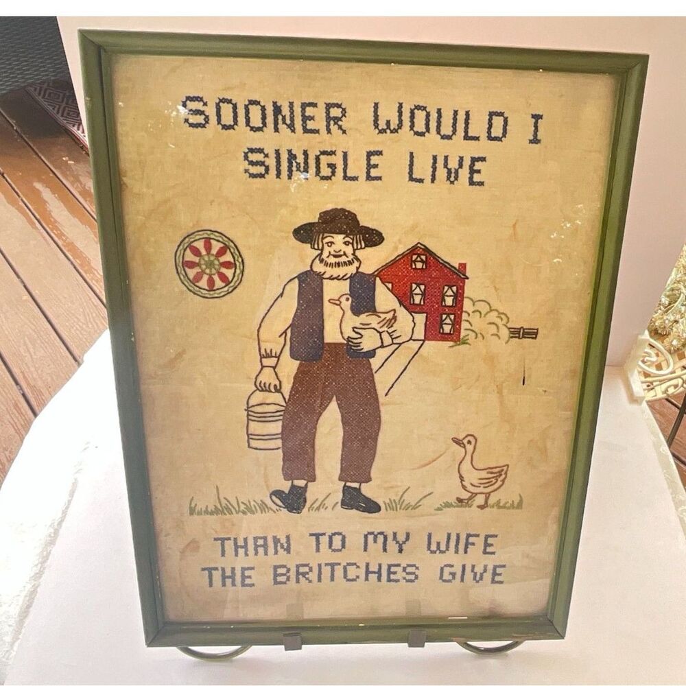 Antique folk art cross stitch/needlepoint piece framed under glass Amish man
